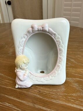 White with pink trim ceramic frame with girl kneeling praying in pink